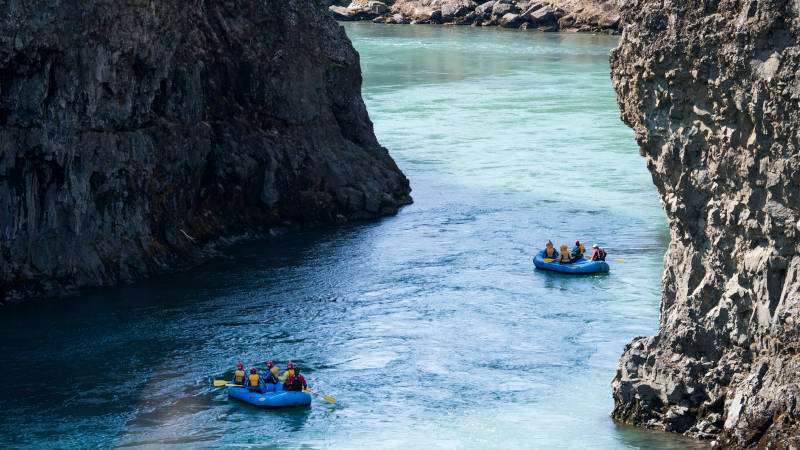 The Golden Circle & River Rafting Expedition boats on the river