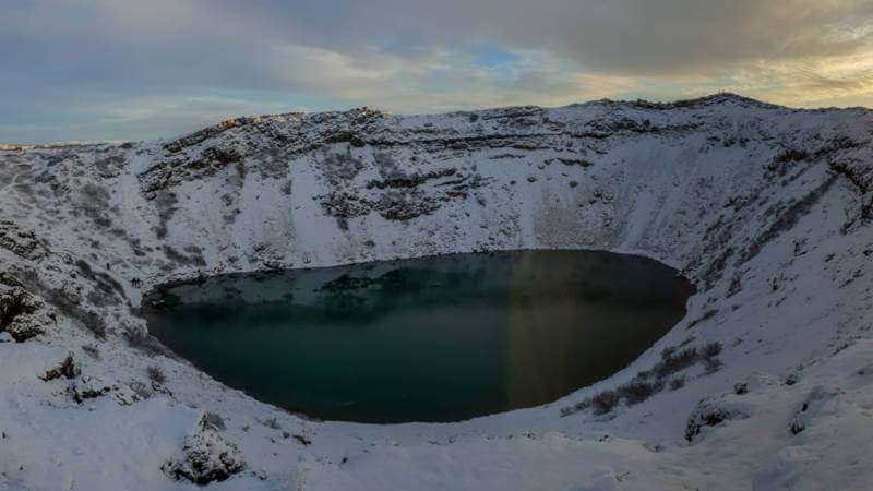 Kerid crater at winter with dark lake in the caldera
