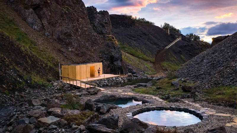 Canyon Baths in Husafell, panoramic view over the baths, facilities and main entrance during a sunset time
