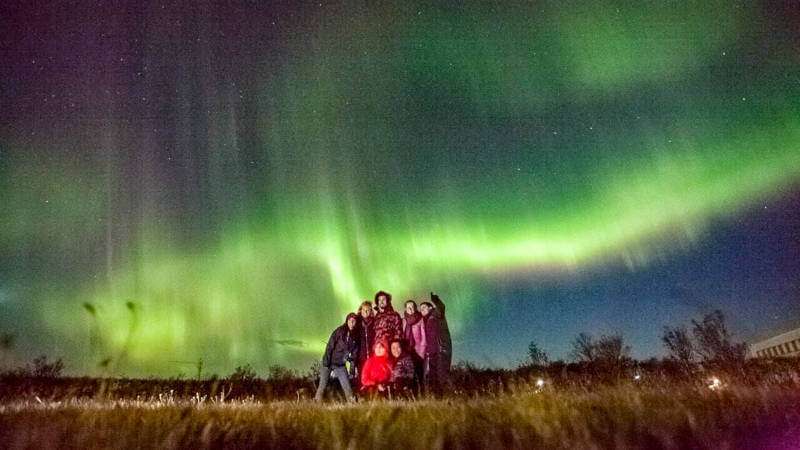 Aurora Overnight stay in Suðursveit people looking at northern lights