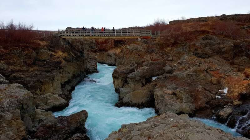 Barnafoss Waterfalls rapids and a bridge above