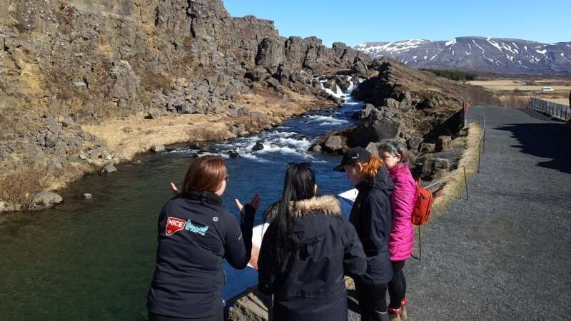 Travelers in Iceland at thingvellir on a sunny day