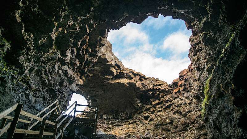 Inside the lava cave, entrance to the cave with staircase