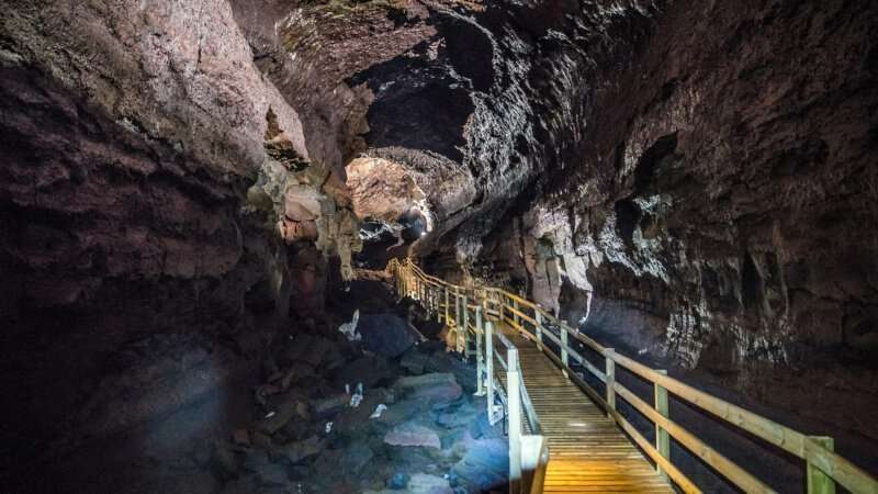 Lava Cave paths inside with white light on the walls