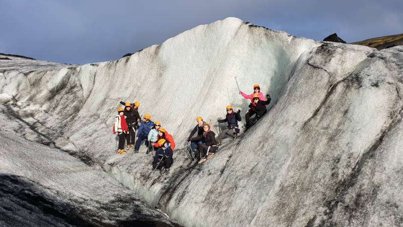 Glacier hike on a sunny day, group photo with people