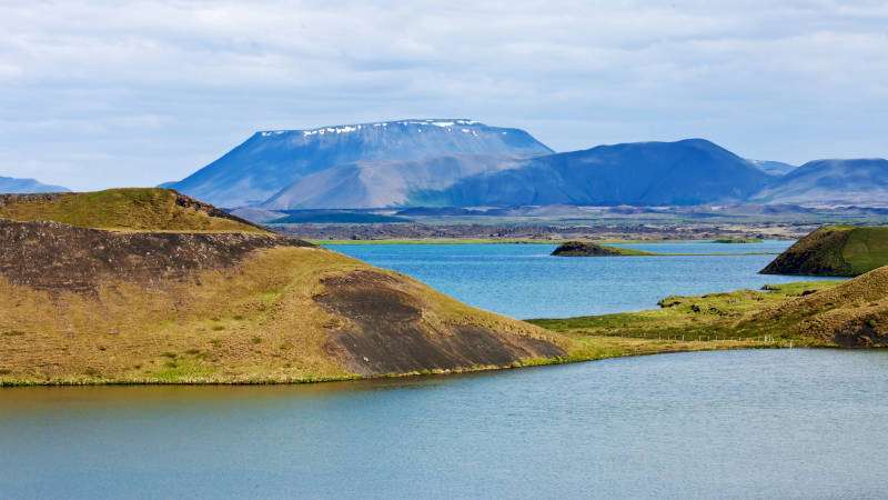 Lane Myvatn Iceland with green hills on a sunny day