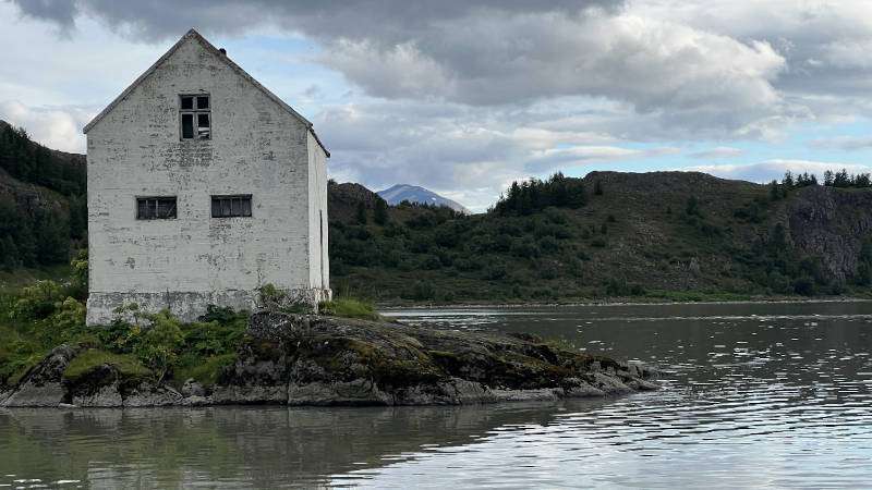 Lonely white house on the shore in Iceland