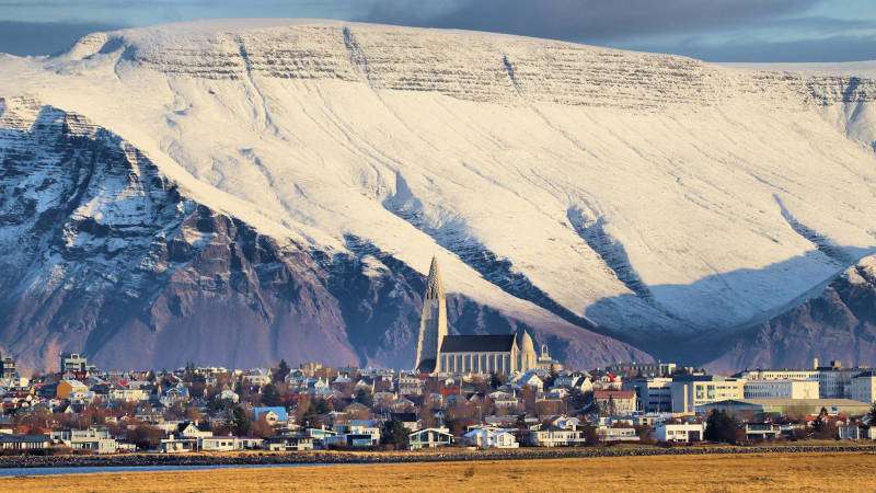 Overnight Stay In Reykjavik city skyline with mountains in the background