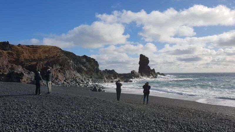 Djupalonssandur on a sunny day with people taking pictures