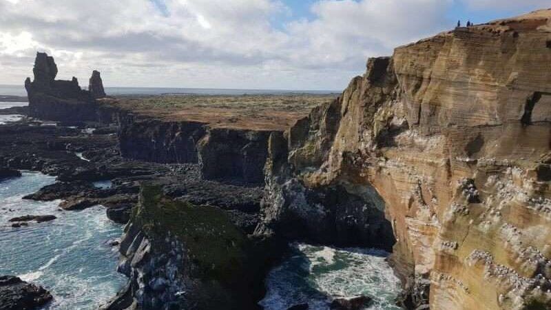 Lóndrangar cliffs with bird colonies on a sunny day