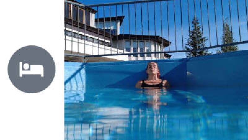 Overnight Stay in Hveragerdi, woman relaxing in a geothermal hot tube