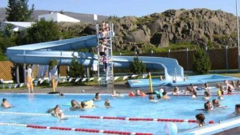 Egilsstaðir Pool with people enjoying a sunny day in Iceland