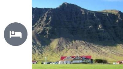 Overnight stay in Suðursveit view over the farm with grass fields and mountains