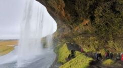 Seljalandsfoss path behind with people walking