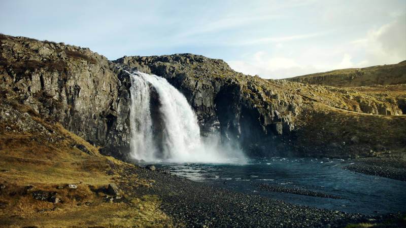 Fossfjörður waterfall on a sunny day