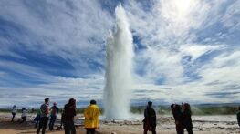 Icelandic gaysir erupting on a sunny day