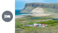 Overnight stay in Breiðavík, view on a green mountain slopes